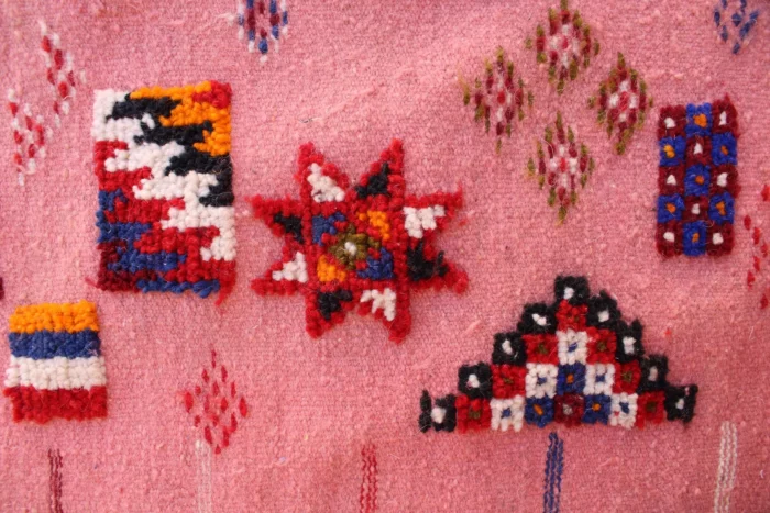 Intricately woven Moroccan rug with geometric patterns
