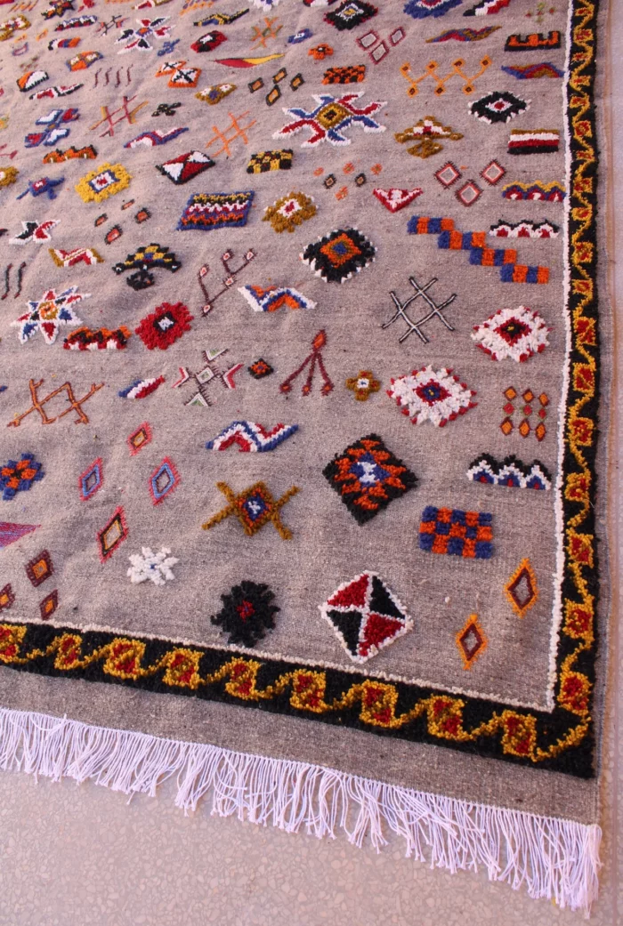 Unique Moroccan rug featuring a fusion of patterns and colors