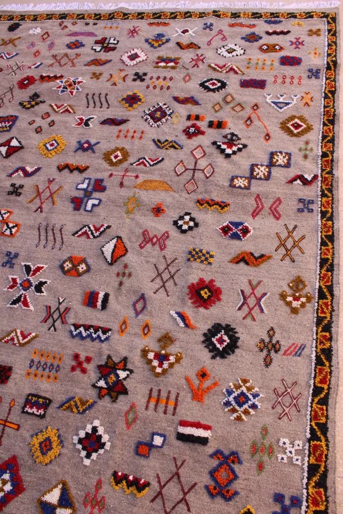 Unique Moroccan rug featuring a fusion of patterns and colors