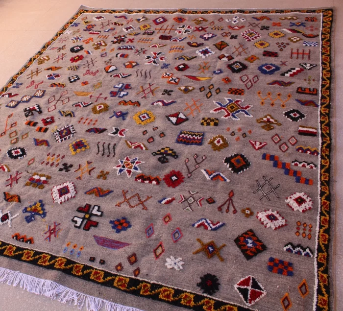 Unique Moroccan rug featuring a fusion of patterns and colors