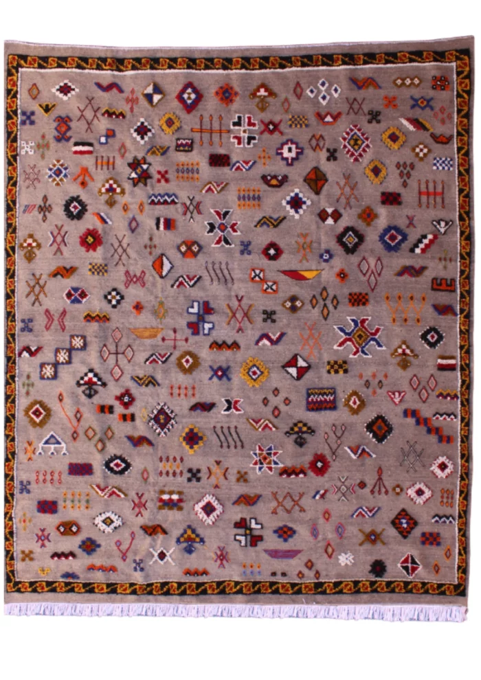 Unique Moroccan rug featuring a fusion of patterns and colors