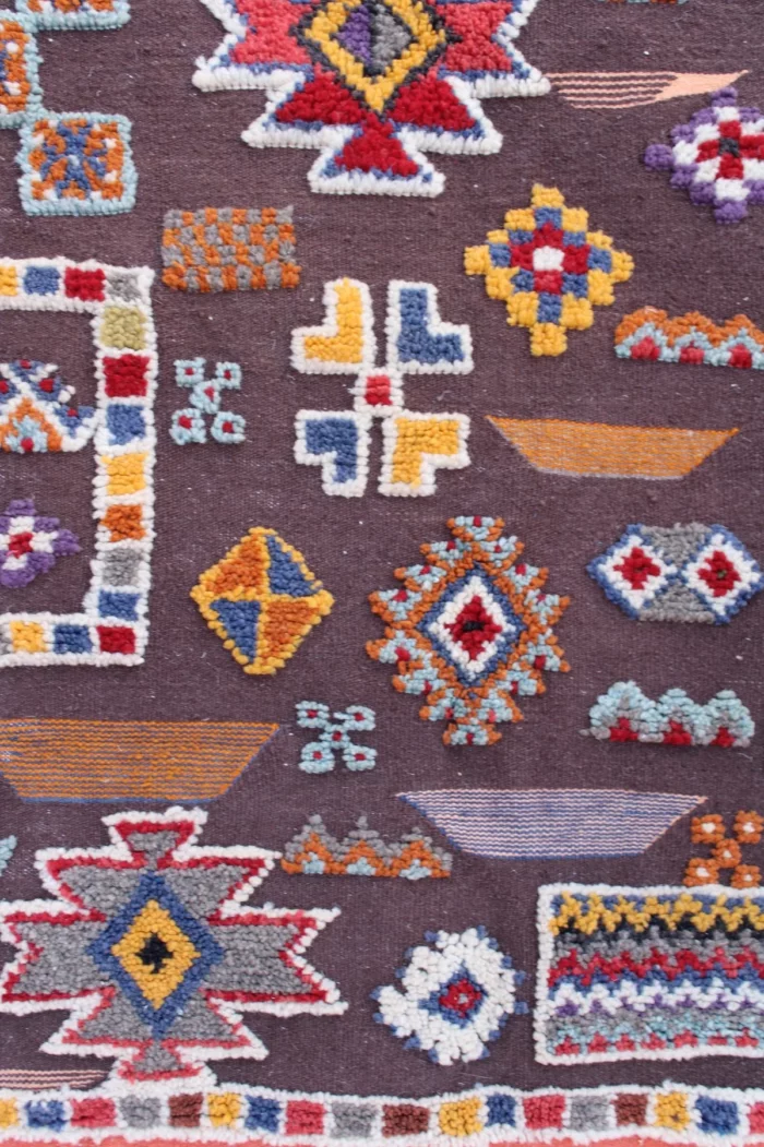 Handwoven Moroccan Berber rug featuring traditional geometric patterns
