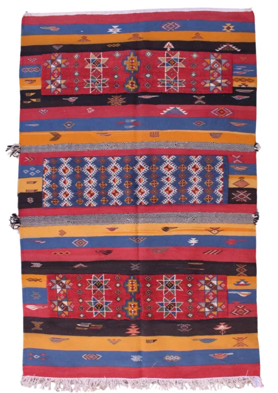 Handwoven Moroccan rug featuring traditional Berber patterns and vibrant colors