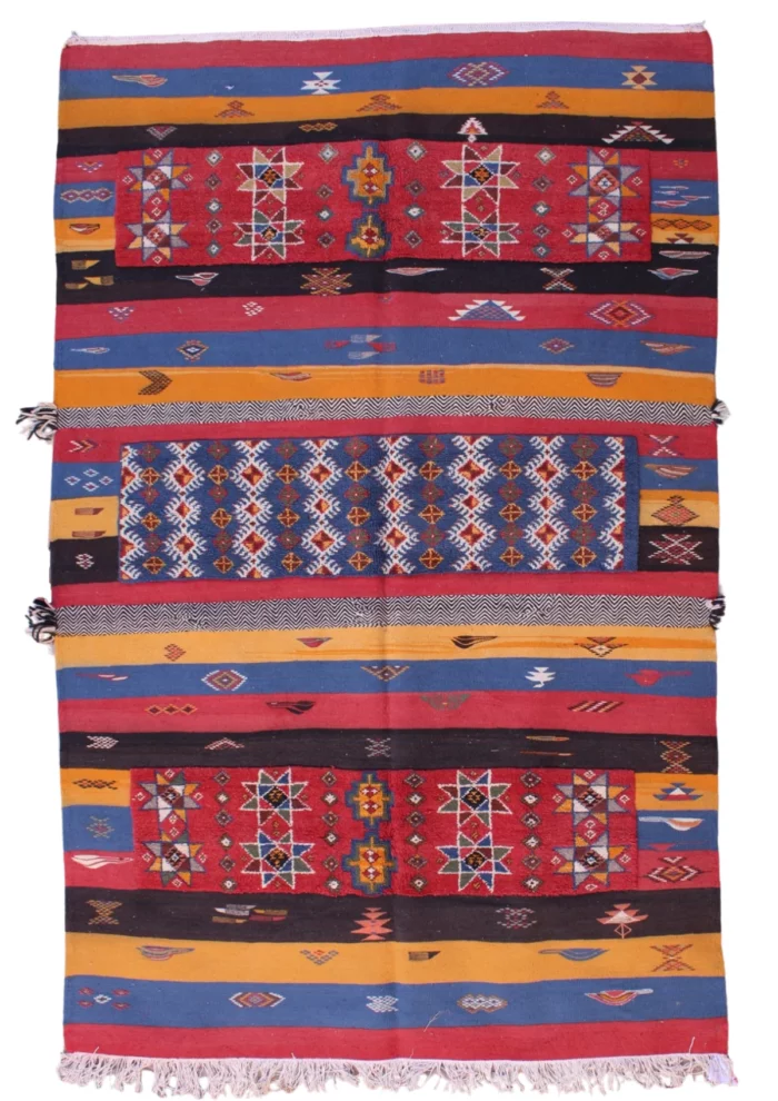 Handwoven Moroccan rug featuring traditional Berber patterns and vibrant colors